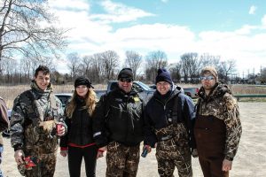 Members of Ducks Unlimited-Wayne State University Chapter volunteer with the DNR to clean up St. John’s Marsh near the North Channel of the St. Clair River. Adam Smith, chapter president, is far left. Photo credit: Ducks Unlimited