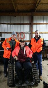 Vietnam War veteran Billy Myer, center, was able to get back outdoors again with the help of MiOFO. More than 20 guides are trained to assist those with health challenges in their outdoor adventures. PHOTO CREDIT: Michigan Operation Freedom Outdoors