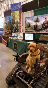 When Program Coordinator Tom Jones is out promoting MiOFO among outdoorsmen, his service dog Baxter always comes along for the ride, too. PHOTO CREDIT: Michigan Operation Freedom Outdoors