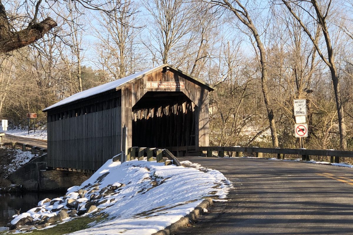 Wooden covered bridge during early winter